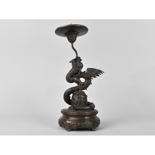 69 - A Patinated Bronze Candle Pricket Modelled as a Dragon, Circle Base, 24cm High