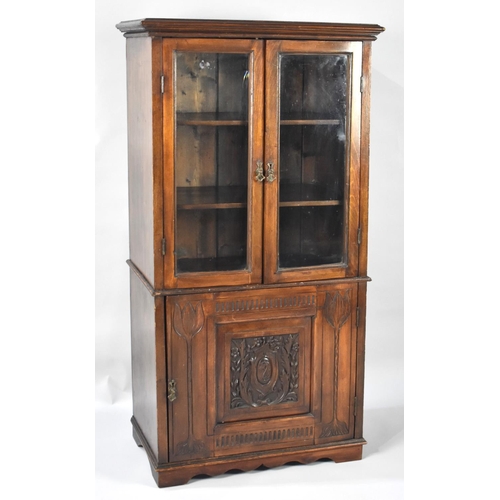 86 - An Edwardian Glazed Cabinet with Carved Panelled Door having Heraldic Design to Base Cupboard and Ra... 