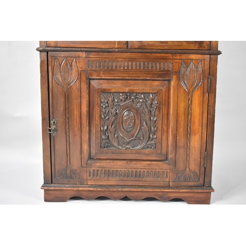 86 - An Edwardian Glazed Cabinet with Carved Panelled Door having Heraldic Design to Base Cupboard and Ra... 