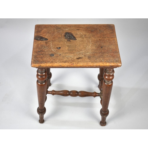 93 - A Late 19th/Early 20th Century Rectangular Topped Stool with Turned Supports and Stretchers, 38cm X ... 