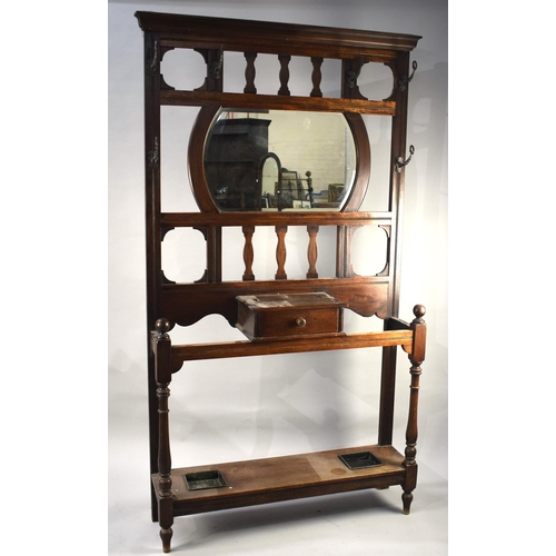 120 - An Edwardian Mahogany Hall Stand with Centre Glove Drawer , Mirror with Bevelled Glass , Six Coat Ho... 