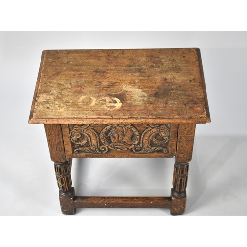 102 - A Carved Oak Rectangular Topped Stool, 48cms Wide