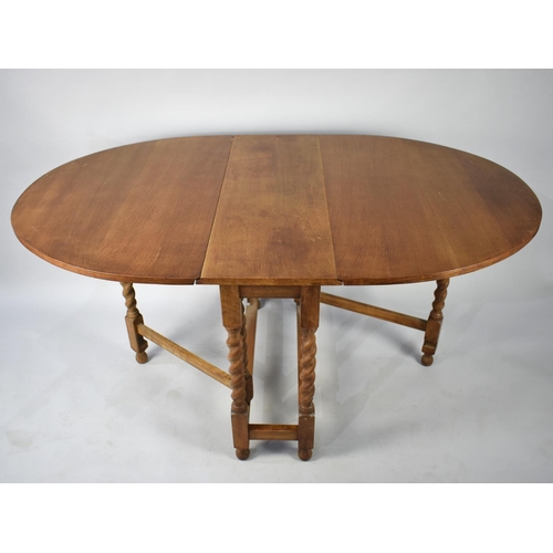 106 - A Mid 20th Century Light Oak Drop Leaf Barley Twist Gate Leg Table, 91cms Long