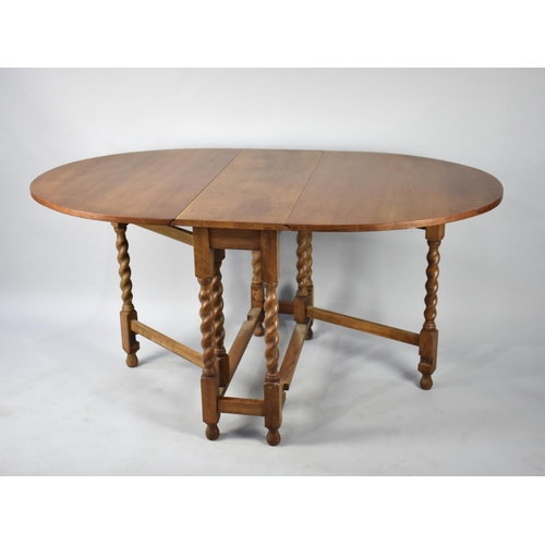 106 - A Mid 20th Century Light Oak Drop Leaf Barley Twist Gate Leg Table, 91cms Long