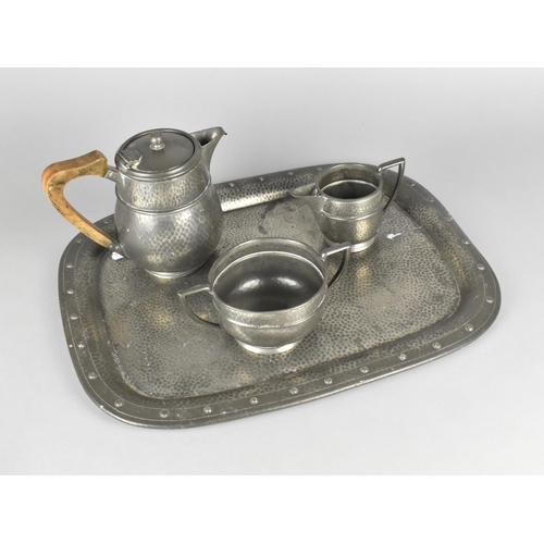 176 - A Hand Beaten Arts and Crafts Rectangular Pewter Tray together with a Frank Cobb Three Piece 'Period... 