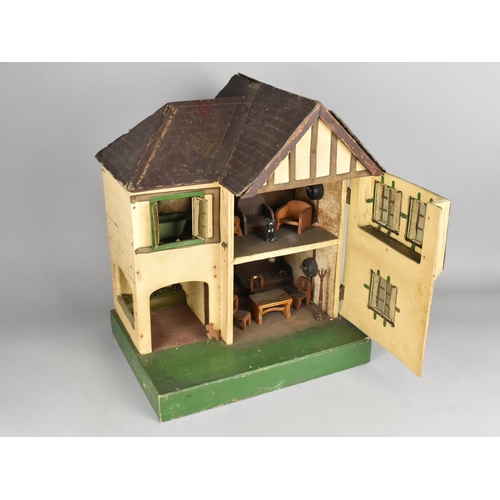 210 - A Triang Dolls House and Furniture