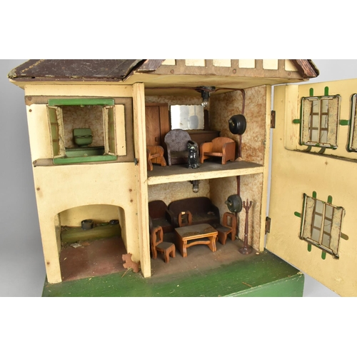 210 - A Triang Dolls House and Furniture