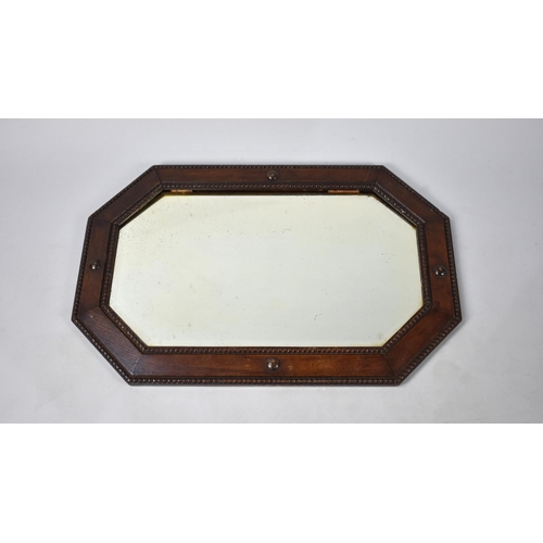 235 - An Edwardian Oak Framed Wall Mirror, 75cms Long