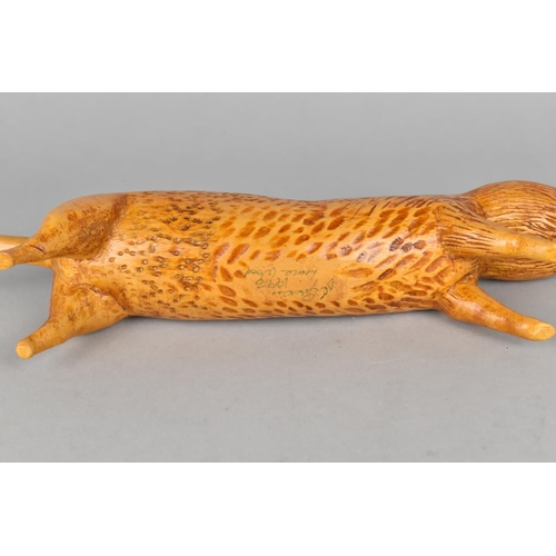 41 - A Carved Lime Wood Study of a Ferret, 28cms Long