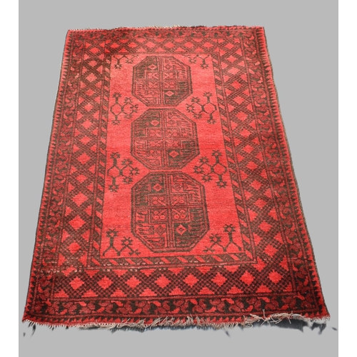 486 - A Vintage Persian Pattern Rug on Red Ground, 123x78cm