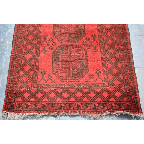 486 - A Vintage Persian Pattern Rug on Red Ground, 123x78cm