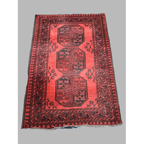 489 - A Vintage Persian Pattern Rug on Red Ground, 145x100cm