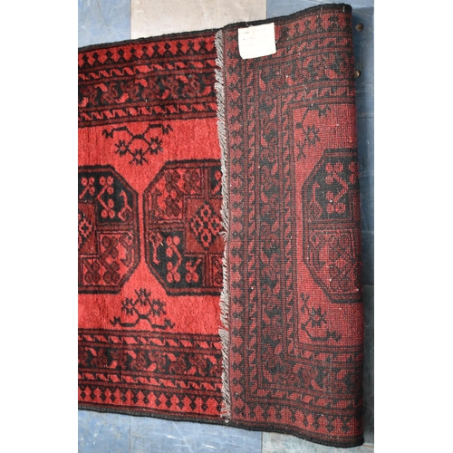 489 - A Vintage Persian Pattern Rug on Red Ground, 145x100cm