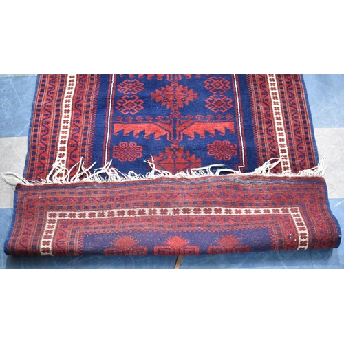 492 - A Patterned Rug on Red and Blue Ground, 183x109