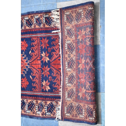 493 - A Patterned Rug on Blue Ground, 137x78cm