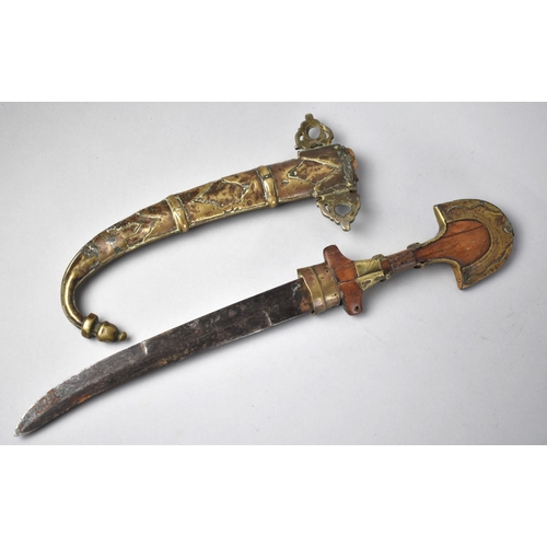 55 - An Indian Curved Blade Dagger with Brass Mounted Wooden Handle and Scabbard, 40cms Long