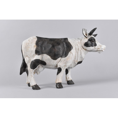 73 - A Modern Carved Wooden Study of a Friesian Dairy Cow, 30cms Long