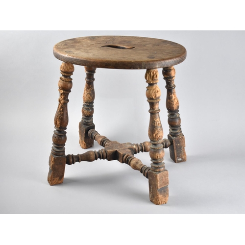 74 - An Edwardian Oval Topped Stool with Turned Supports and Cross Stretcher, Legs have Been Pet Chewed