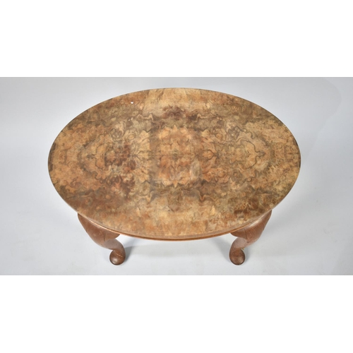 96 - A Mid 20th Century Burr Walnut Oval Topped Stool, 56cms Long