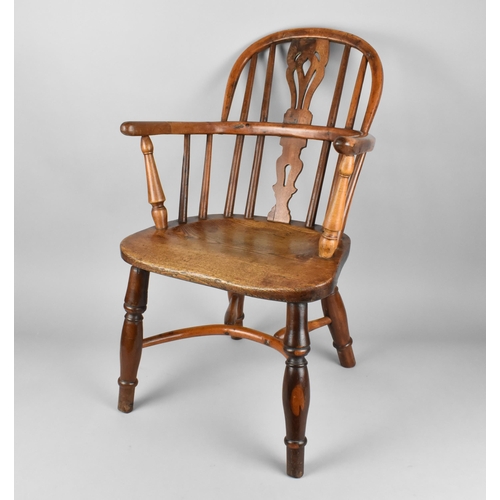 448 - A 19th Century Child's Windsor Armchair, The Back with Pierced Splat and Turned Rails Above Conformi... 