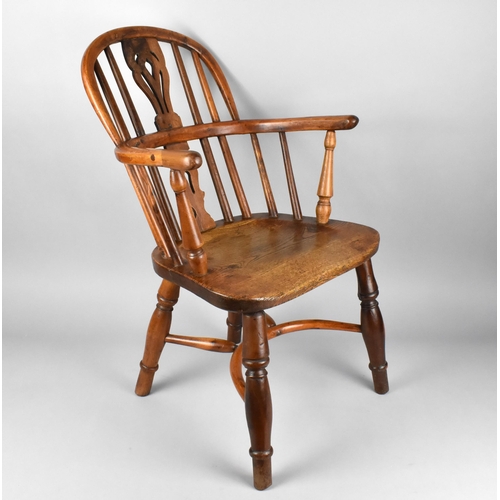 448 - A 19th Century Child's Windsor Armchair, The Back with Pierced Splat and Turned Rails Above Conformi... 