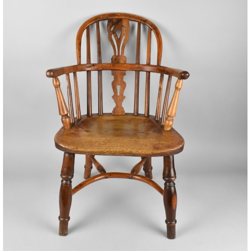 448 - A 19th Century Child's Windsor Armchair, The Back with Pierced Splat and Turned Rails Above Conformi... 