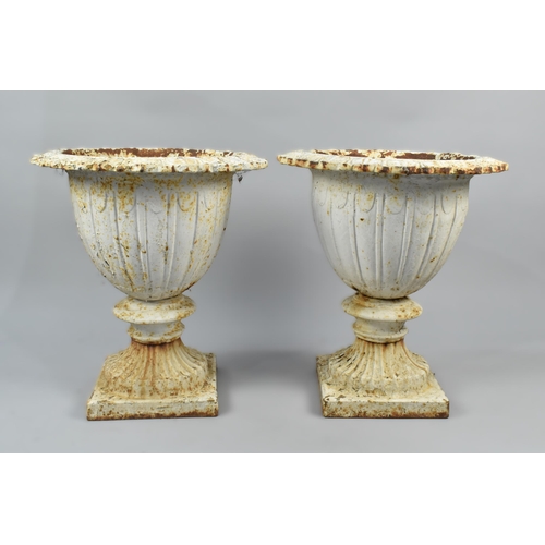 433 - A Pair of Victorian White Painted Cast Iron Garden Urns of Campana Form on Square Bases, 49cm High