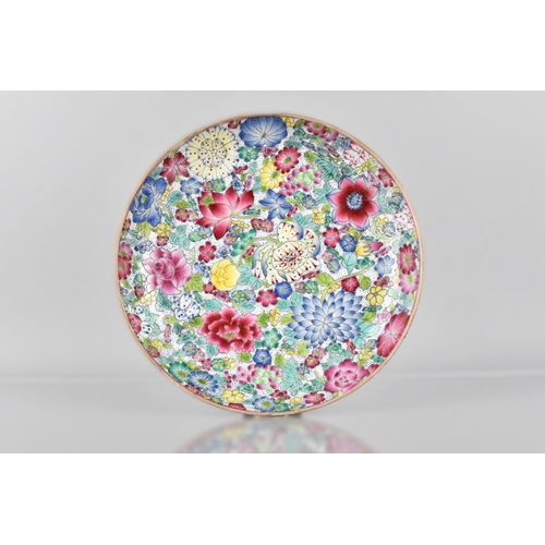 394 - A Late Chinese Qing Period Porcelain Famille Rose 'Hundred Flowers' Dish, Blue Qianlong Seal Mark to... 