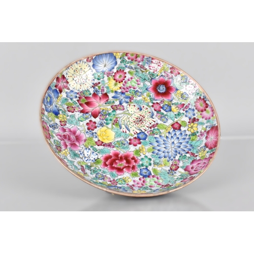 394 - A Late Chinese Qing Period Porcelain Famille Rose 'Hundred Flowers' Dish, Blue Qianlong Seal Mark to... 