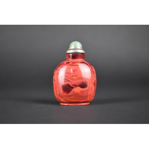 378 - A Chinese Red Hardstone Snuff Bottle with White Metal and Jade Stopper, 7.5cm High