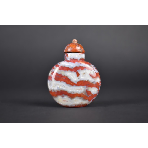 377 - A Chinese Red and Grey Banded Hardstone Snuff Bottle with Stopper, 7.5cm