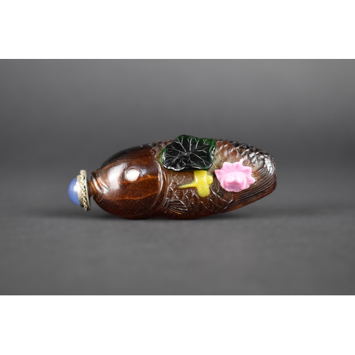 367 - A Chinese Overlaid Glass Snuff Bottle Modelled as a Fish with Carved Lily Pads, Flowers and Dragonfl... 