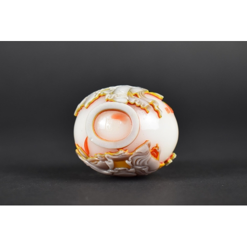 365 - A Chinese Overlaid Glass Snuff Bottle with Fine Relief Decoration Detailing Deities, Opaque White Gr... 