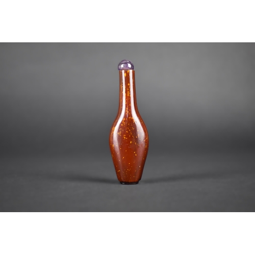 376 - A Chinese Gold Flecked Hardstone Snuff Bottle with Amethyst Stopper, 9cm High