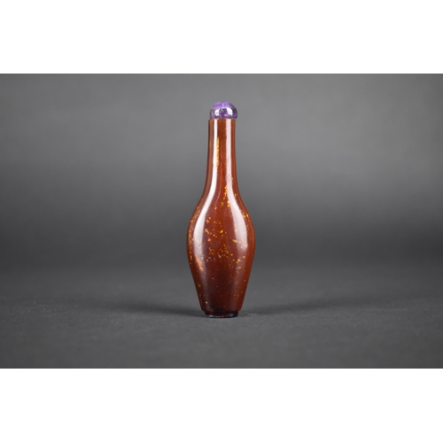 376 - A Chinese Gold Flecked Hardstone Snuff Bottle with Amethyst Stopper, 9cm High