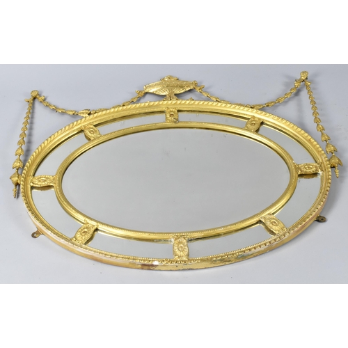 181 - A 19th Century Giltwood Gesso Oval Wall Mirror, Having Eight Oval Paterae With Central Bevel Cut Pan... 