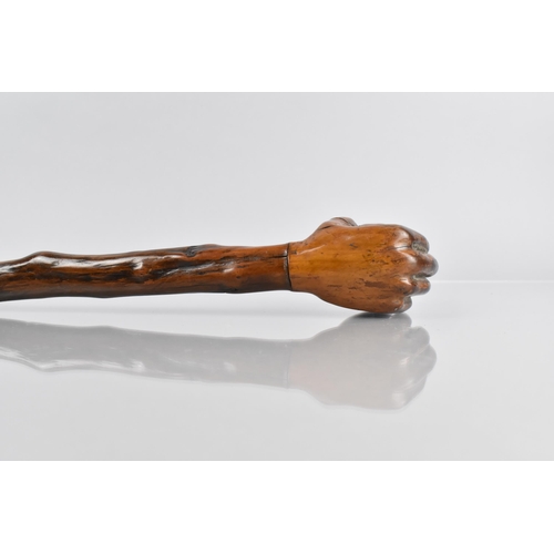 107 - A Late Treen 19th/20th Century Walking Stick, the Handle Modelled in the Form of a Hand Holding a Ba... 