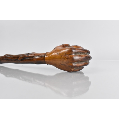 107 - A Late Treen 19th/20th Century Walking Stick, the Handle Modelled in the Form of a Hand Holding a Ba... 