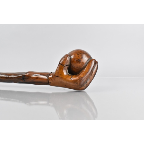 107 - A Late Treen 19th/20th Century Walking Stick, the Handle Modelled in the Form of a Hand Holding a Ba... 