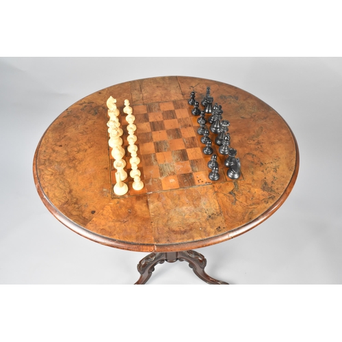 88 - A Late Victorian Walnut Games Table, The Drop Leaf Top with Inlaid Chess Board On Tripod Base Having... 