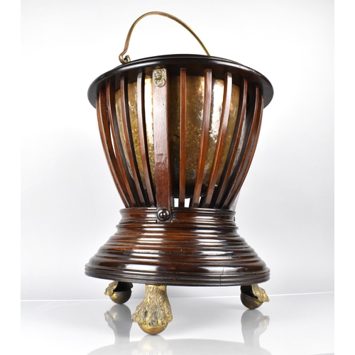 73 - A Mahogany Regency Jardiniere of Urn From with Slatted Body Having Lion Ring Masks and Raised on Thr... 