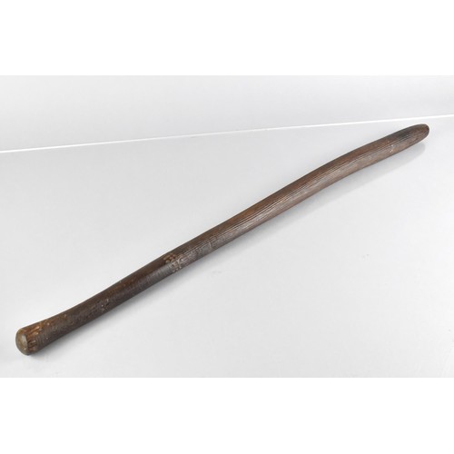 71 - An Aboriginal Throwing Stick with Long Incised Grooves, 66cm Long