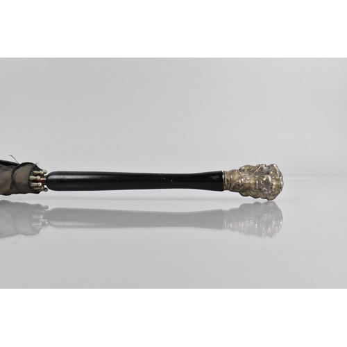 64 - An Early 20th Century Ladies Parasol with Ebonised Handle and White Metal Finial Modelled as a Dogs ... 