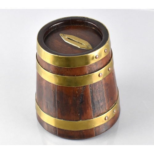 57 - A Late 19th/Early 20th Century Oak and Brass Banded Money Box of Coppered Barrel Form, 14cm High