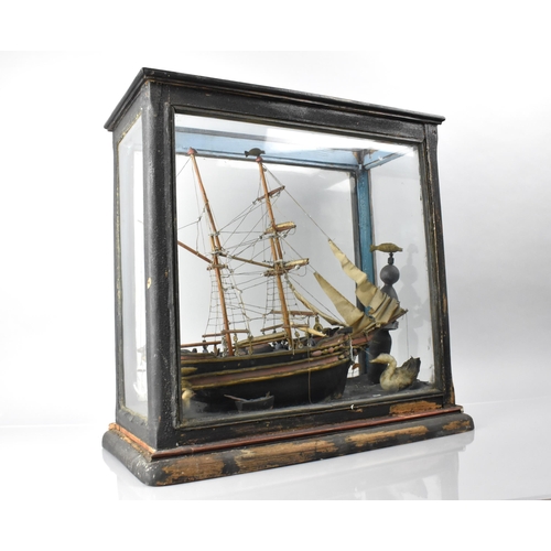 21 - A 19th/20th Century Folk Art Model of a Ship with Seagulls and Lighthouse in Glazed Ebonised Display... 