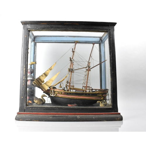 21 - A 19th/20th Century Folk Art Model of a Ship with Seagulls and Lighthouse in Glazed Ebonised Display... 