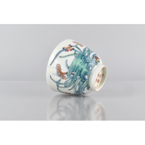 416 - A Chinese Porcelain Doucai Tea Bowl Decorated with Flowers, Six Character Mark for Guangxu, 6cm High