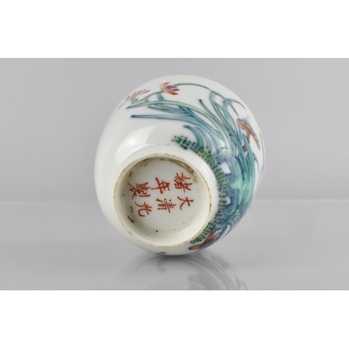 416 - A Chinese Porcelain Doucai Tea Bowl Decorated with Flowers, Six Character Mark for Guangxu, 6cm High