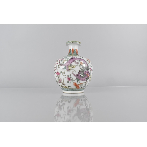 400 - A Chinese Qing Period Porcelain Bottle Vase Decorated in the Famille Rose Palette with Dragons Among... 