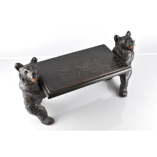 66 - A Late 19th Century Black Forest Table Top Stand Modelled with Carved Bears Supporting Carved Top, D... 